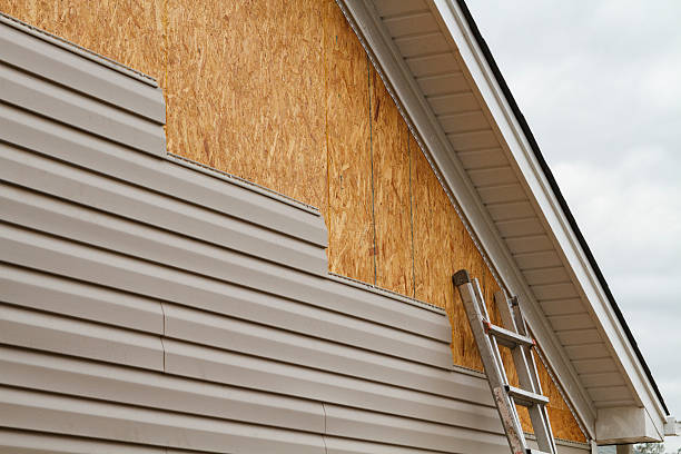 Professional Siding Repair technician working in Manor, PA